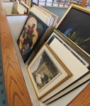 Photos and paintings laid out for viewing